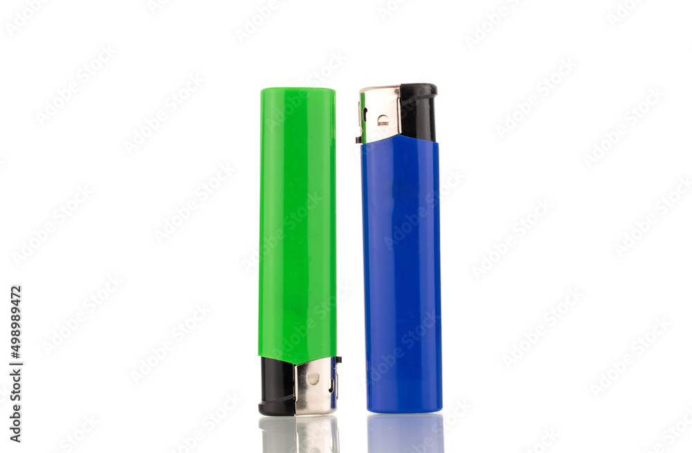 Two colored lighters, macro, isolated on a white background. Two colored lighters, macro, isolated on a white background.