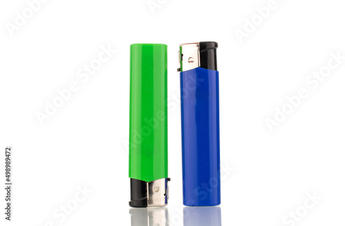 Two colored lighters, macro, isolated on a white background.