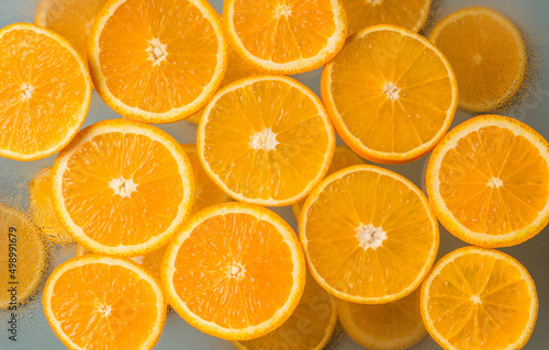 Juicy citrus fruits. Orange slices on a light background. Top view. Healthy natural product.