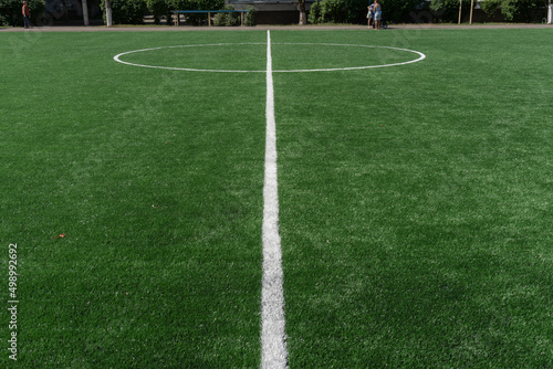 Marking on a modern stadium with artificial turf. School stadium. © hannamartysheva