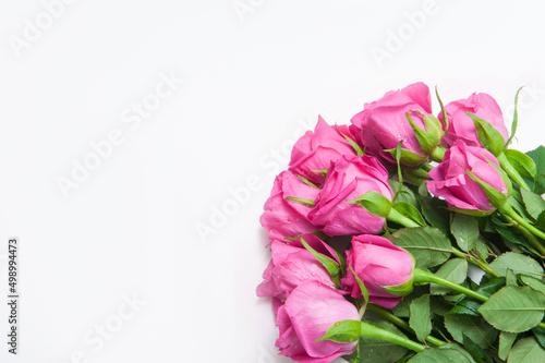 Bouquet of pink roses on a white background © Olga Koronyevska