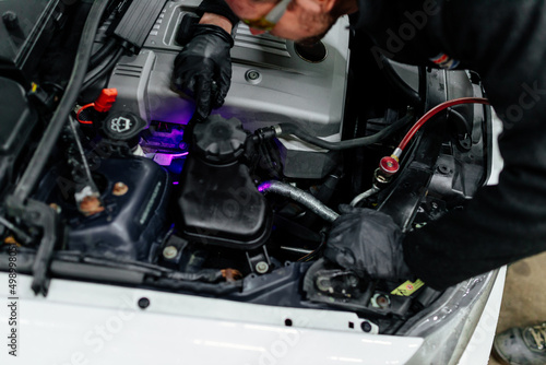 Professional car mechanic servicing car air conditioner. Car repair shop. © Aleksandrs Muiznieks