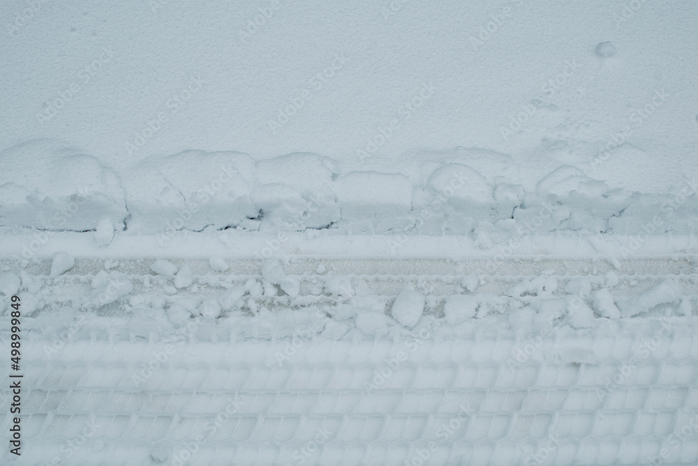 The footprint of a car tire in the snow The footprint of a car tire in the snow