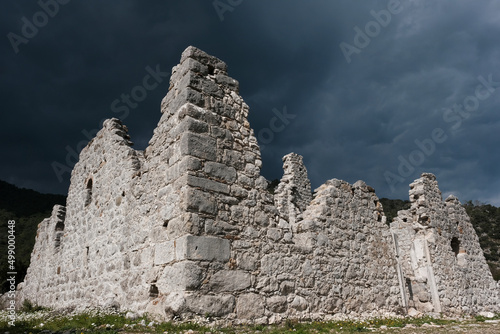 Ruins of antic Olympos against a stormy dramatic sky. Turkey.