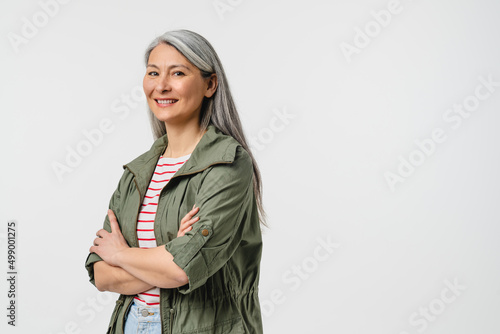 Принти на полотні Side view portrait of a smiling with toothy smile mature middle-aged woman in ca