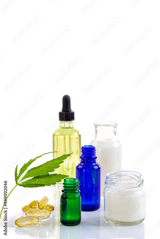 Hemp leaf with bottle of essential oils. Hemp leaf with bottle of essential oils.