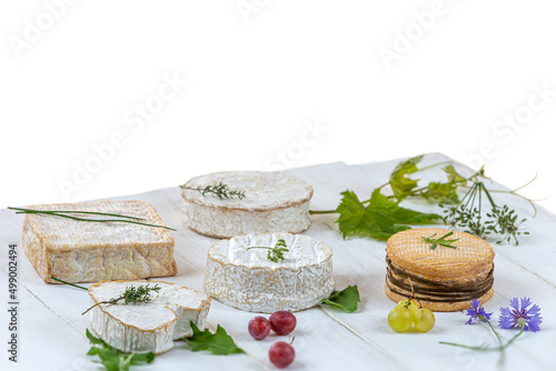 Normans cheese platter on a white wooden table on a white background. photo