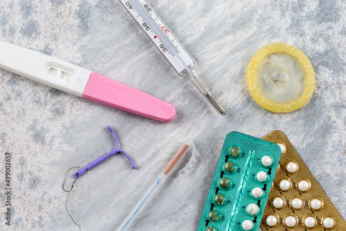 Close-up of IUDs birth control pills and other means of contraception. photo
