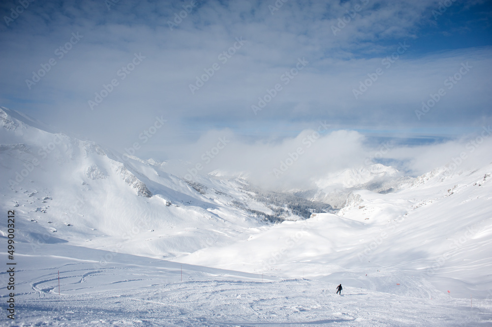 The trackers ensure the safety of the slopes for the skiers. The trackers ensure the safety of the slopes for the skiers.