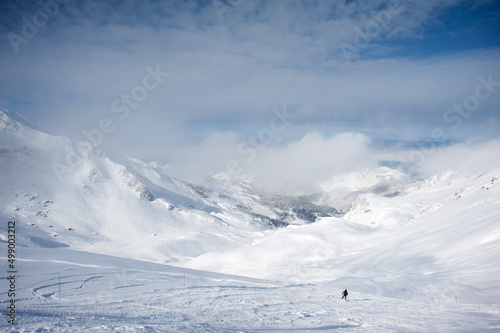 The trackers ensure the safety of the slopes for the skiers.