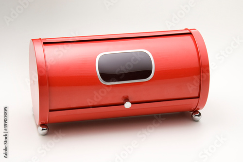Red metal bread box closed, isolated