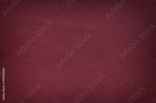 Texture of matte leather maroon color, vignette. photo