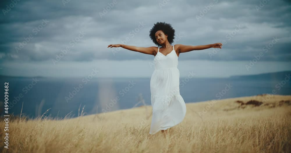 Lifestyle portrait of beautiful young black african american woman in golden field Lifestyle portrait of beautiful young black african american woman in golden field