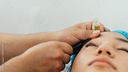 Young woman at a spa with eyelash treatment. Copy space. © Daniel