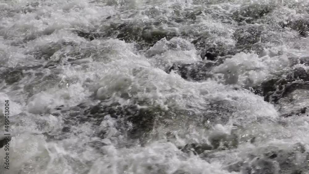 Rapids and water - fast flowing stream of water and foam. Rapids and water - fast flowing stream of water and foam.