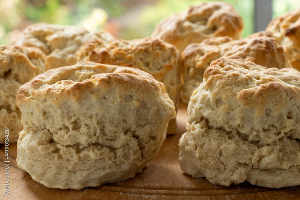 Closeup of homemade scones on a breadboard. Selective focus Closeup of homemade scones on a breadboard. Selective focus