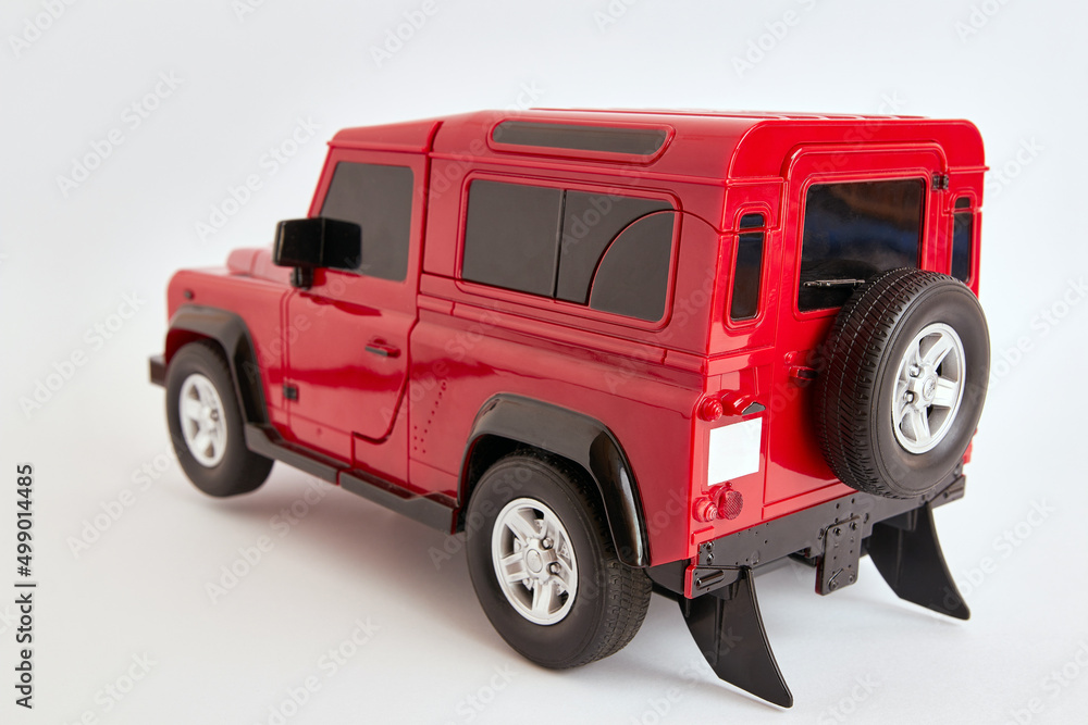 Toy, all-wheel drive SUV in red on a white background.