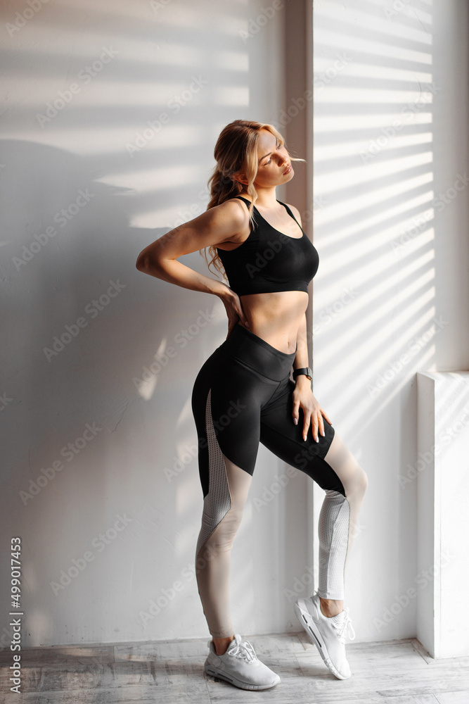 Athletic european woman enjoy sunlight indoors Athletic european woman enjoy sunlight indoors