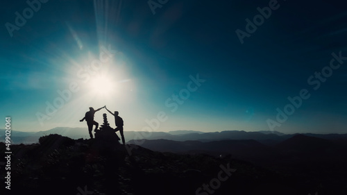 Celebrating success together on the peaks of challenging mountains
