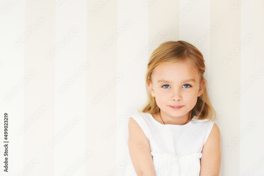 Portrait of adorable little girl with blue eyes wearing white dress Portrait of adorable little girl with blue eyes wearing white dress
