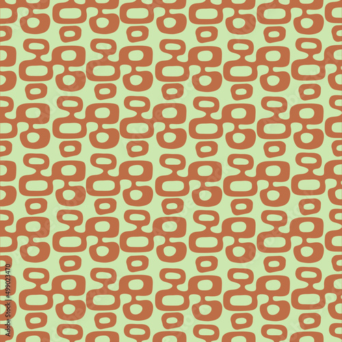 Mint light green and rust burnt orange Mid-Century Modern "Tiki" pattern, repeatable and seamless. 