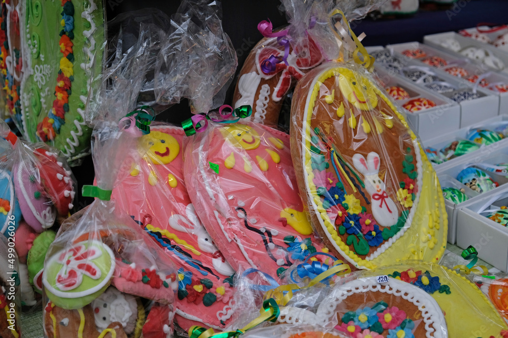 Traditional Easter gingerbread cookies in the shape of a colorful egg with drawings of a hare and chickens are sold at a market in Prague, Czech Republic.