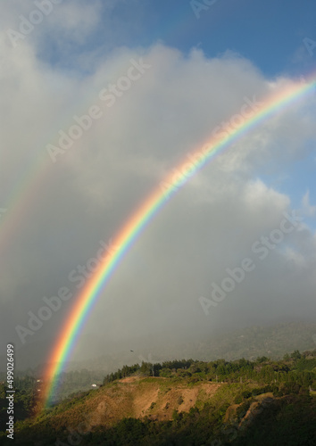 Image of an intense rainbow shown in Boquete, Panama.