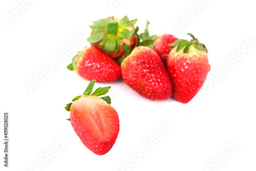 Fototapeta Naklejka Na Ścianę i Meble -  cup of fresh strawberries, fresh vitamin fruit juicy slice with fresh cut, isolated object on a white background, concept of vegetarian, vitamin, wholesome food, healthy eating
