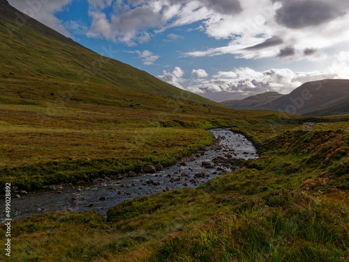 Landscape with sky, mountains stream in Isle of Skye Scotland.