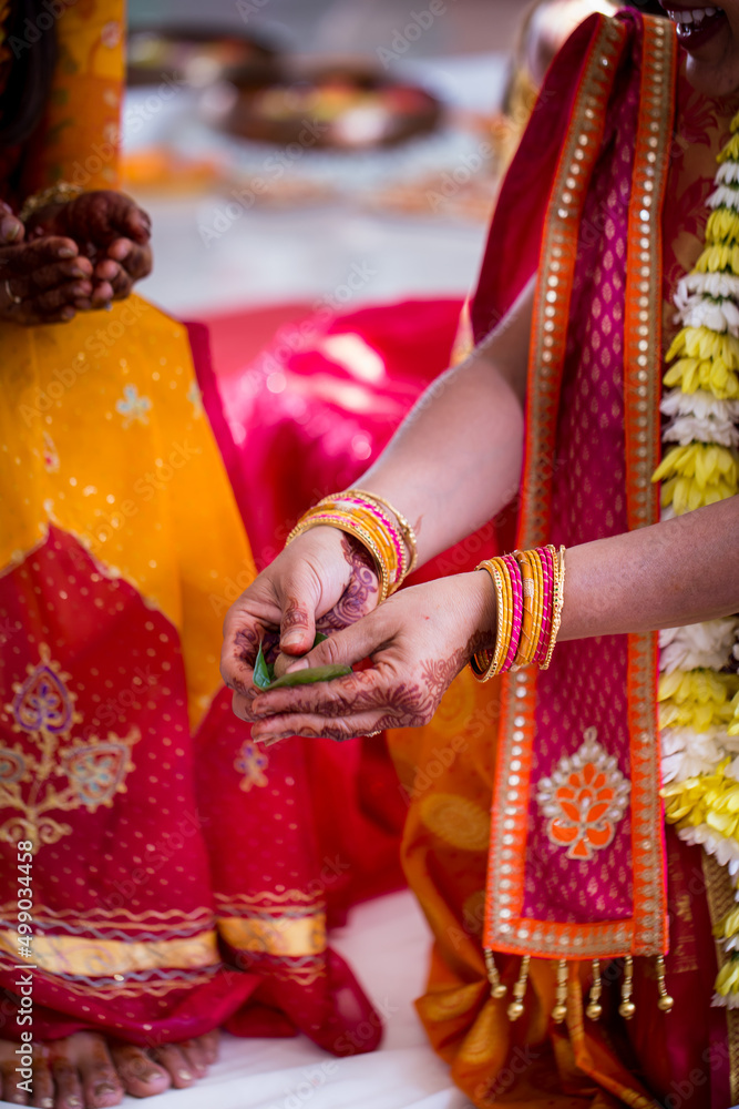 Indian pre wedding haldi ceremony turmeric, hands, feet close up