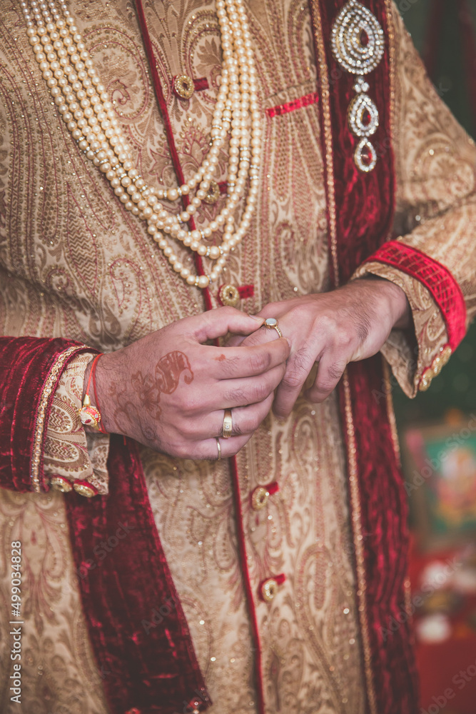 Indian Hindu groom's wedding outfit close up