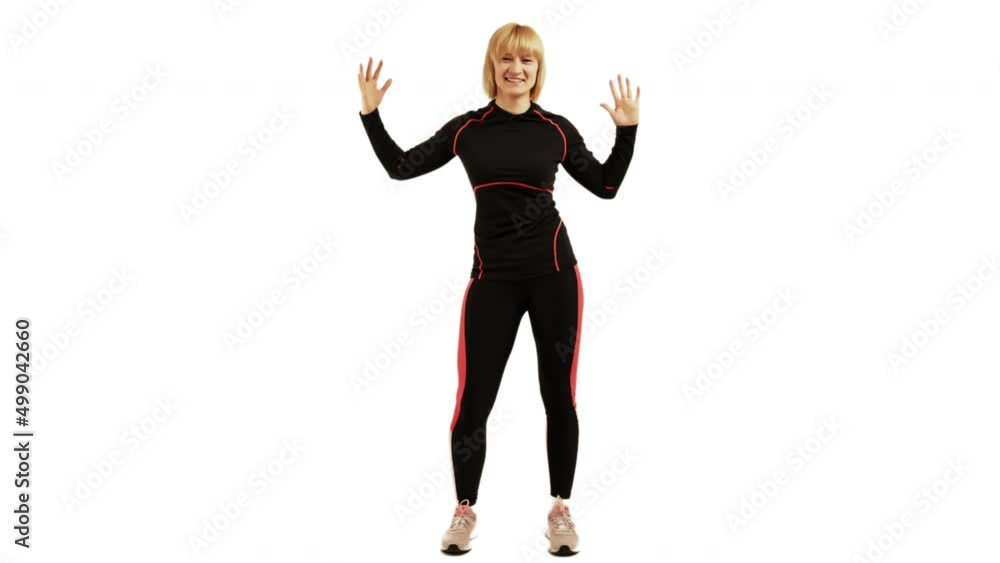 Being sexy dancing as a aerobics instructor on a white backdrop Being sexy dancing as a aerobics instructor on a white backdrop