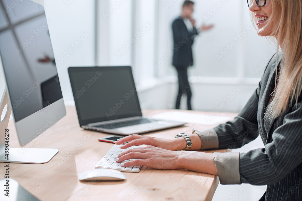 successful business woman smiles at the client,sitting at the office table successful business woman smiles at the client,sitting at the office table