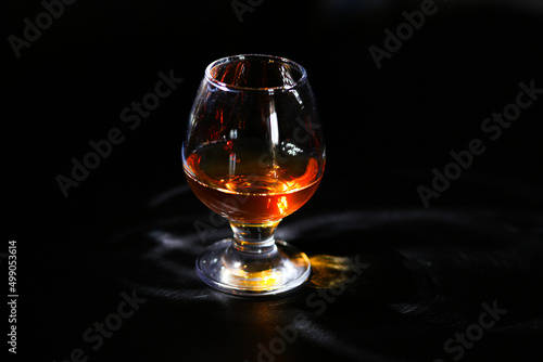 whiskey glass on a black background