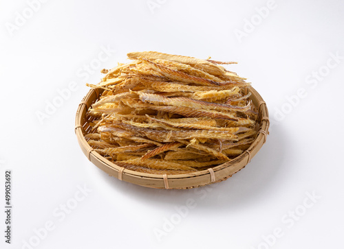 Thinly sliced dried pollack in a traditional basket photo