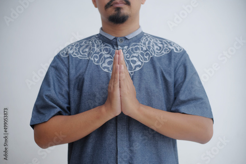 portrait of man with greeting hand gesture photo