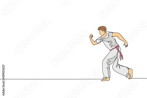 One continuous line drawing young sporty Brazilian fighter man training capoeira on the beach. Healthy traditional fighting sport concept. Dynamic single line draw graphic design vector illustration