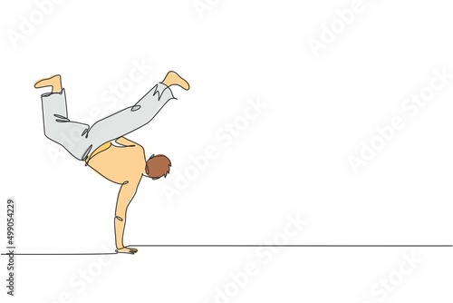 One single line drawing of young energetic man capoeira dancer perform dancing fight vector illustration graphic. Traditional martial art lifestyle sport concept. Modern continuous line draw design