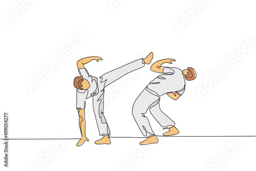Single continuous line drawing of two young sportive men practice Brazilian capoeira move dance at outdoor street. Culture martial art sport concept. Trendy one line draw design vector illustration