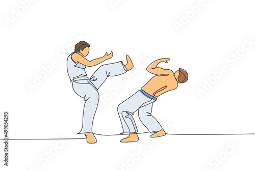 One single line drawing of two young energetic man capoeira dancers perform dancing fight vector illustration. Traditional martial art lifestyle sport concept. Modern continuous line draw design