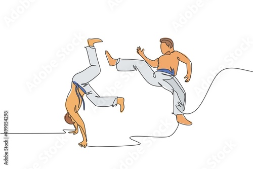 One continuous line drawing of two young sporty Brazilian fighter men training capoeira on the beach. Healthy traditional fighting sport concept. Dynamic single line draw design vector illustration