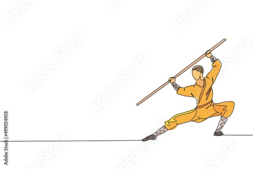 One continuous line drawing young shaolin monk man practice kung fu using long staff at temple ground. Traditional Chinese combative sport concept. Single line draw design graphic vector illustration