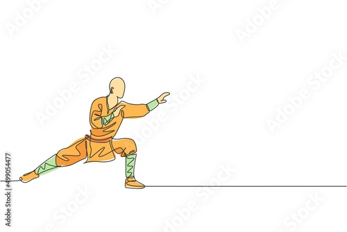 One continuous line drawing of young shaolin monk man practice kung fu style at temple ground . Traditional Chinese combative sport concept. Dynamic single line draw design graphic vector illustration