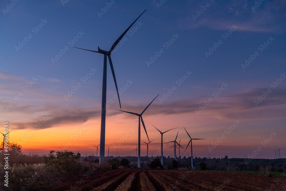 Aerial view Wind turbine will farms in rotation to generate electricity energy on outdoor. Green ecological power energy generation wind farm eco field is sustainable energy concept.