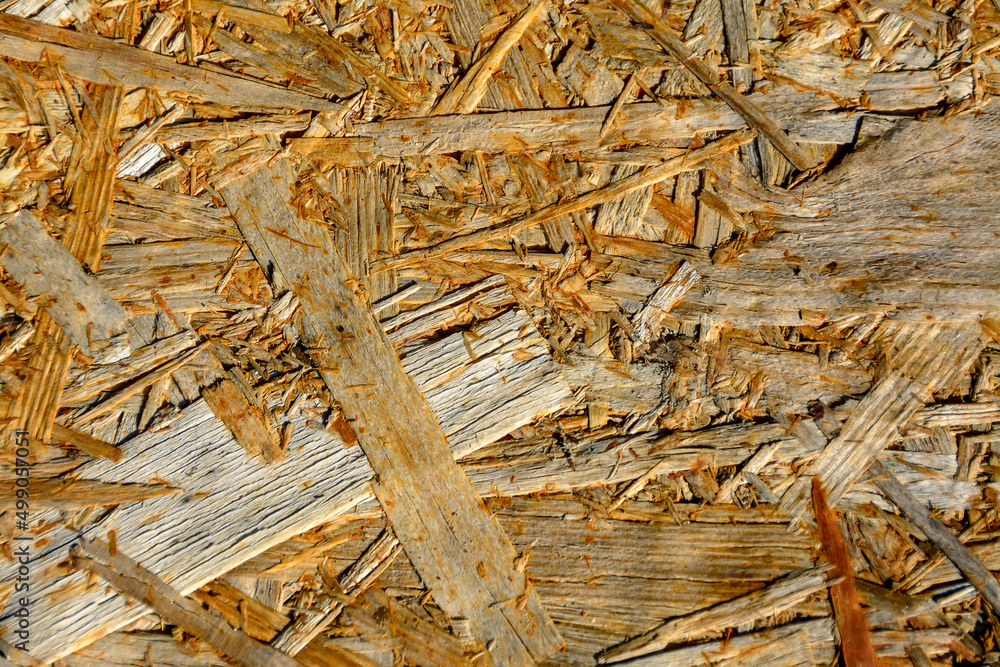 The texture of a wood-fiber board burnt out in the sun. The texture of a wood-fiber board burnt out in the sun.