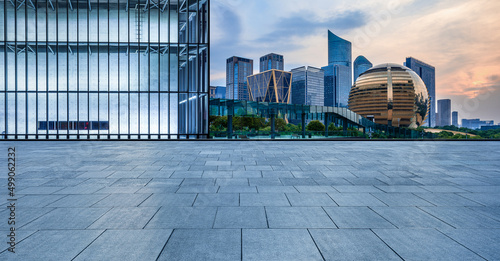 Fototapeta Naklejka Na Ścianę i Meble -  Empty square floor and city skyline with modern commercial buildings in Hangzhou, China.
