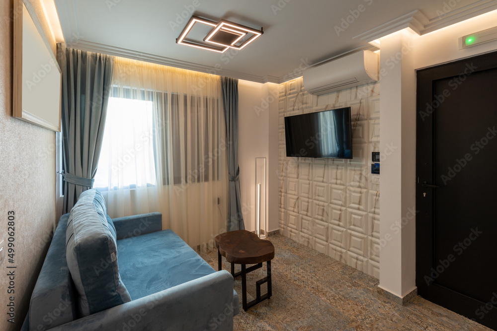 Fototapeta premium Living room interior with wall mounted tv