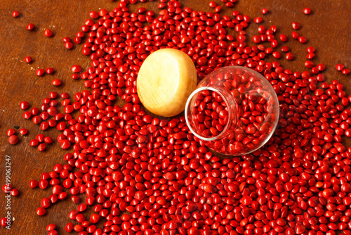 The red seed was in a glass jar and on the ground.