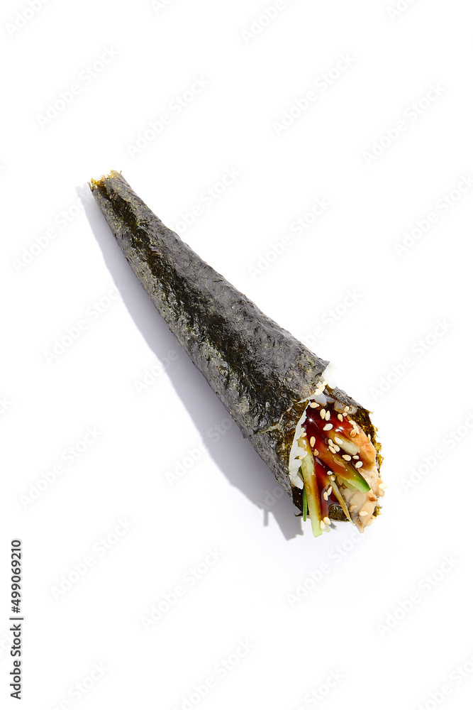 Japanese temaki sushi with eel, cucumber and unagi sauce on white background. Hand roll with eel and vegetables in minimalistic style. Handroll in asian style Japanese temaki sushi with eel, cucumber and unagi sauce on white background. Hand roll with eel and vegetables in minimalistic style. Handroll in asian style