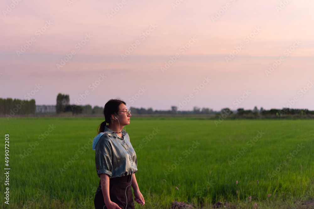 Woman (LGBTQ) posing at nature of rice field Woman (LGBTQ) posing at nature of rice field